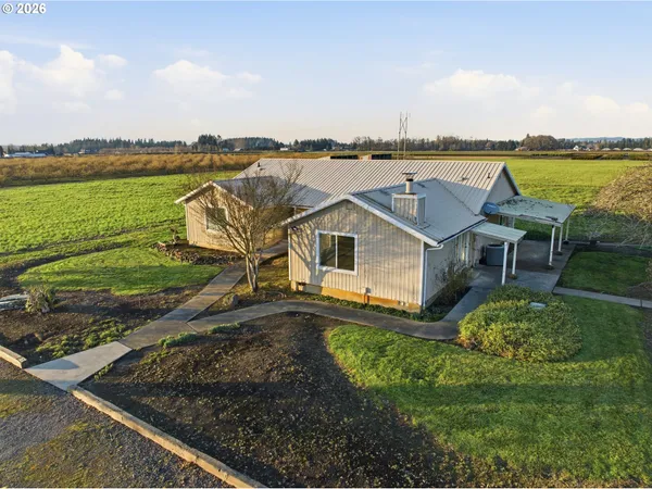 a aerial view of a house with a lake view