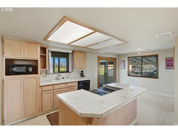 a kitchen with a sink and a microwave