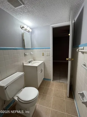 a view of a livingroom and a bathroom