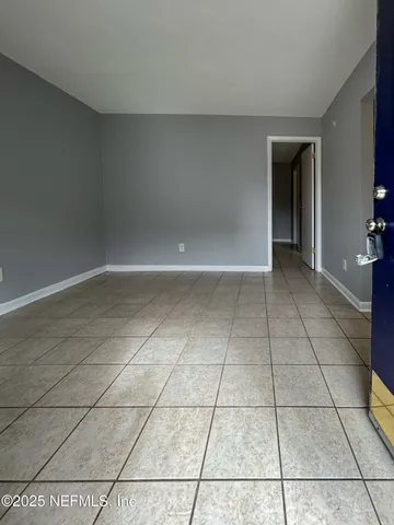 a view of an empty room and window