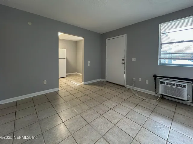 a view of an empty room and window