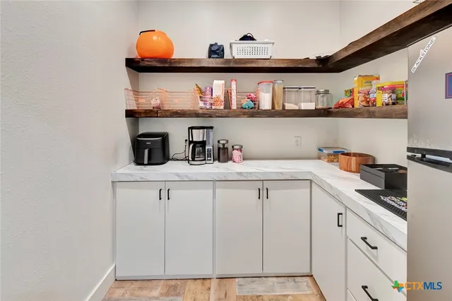 a bedroom with a bed and a view of bathroom