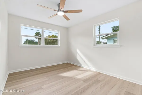 a view of front door with wooden floor