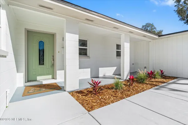 a front view of a house with a patio