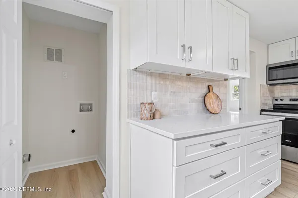 a view of cabinets and window
