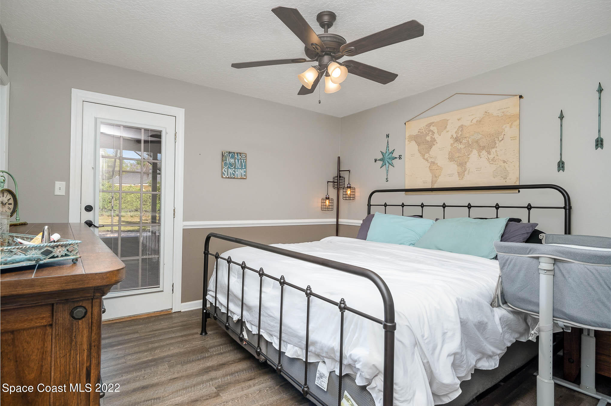 3453 Brevard Road Mims, FL 32754 - Photo 13 of 22 a bedroom with a bed and window