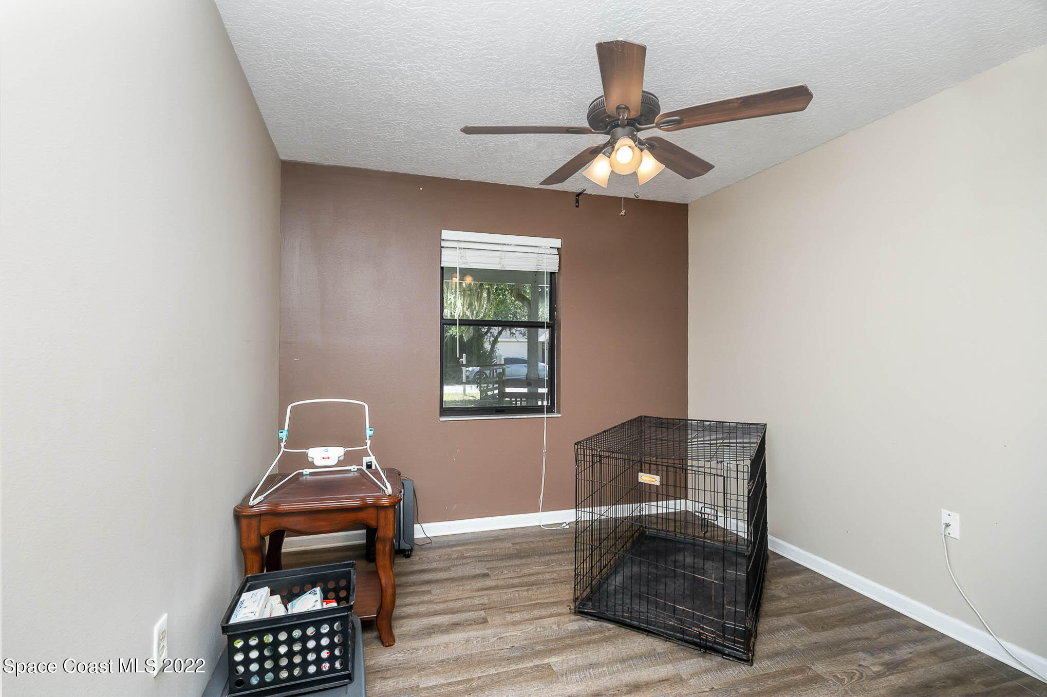 3453 Brevard Road Mims, FL 32754 - Photo 16 of 22 a living room with furniture and a window