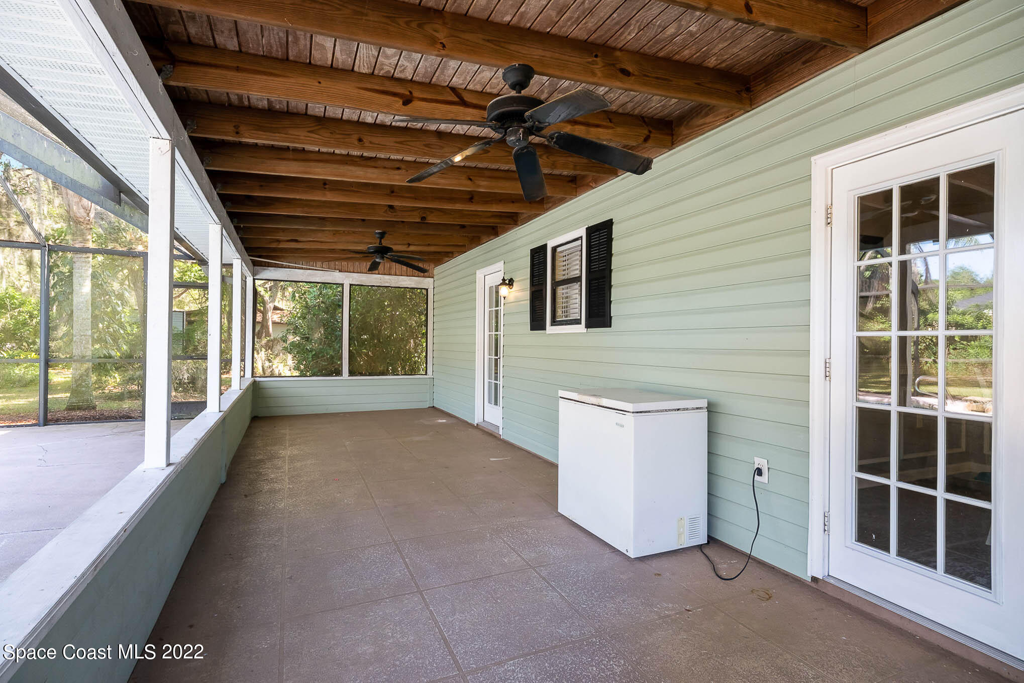 3453 Brevard Road Mims, FL 32754 - Photo 19 of 22 a view of porch with wooden floor and a window