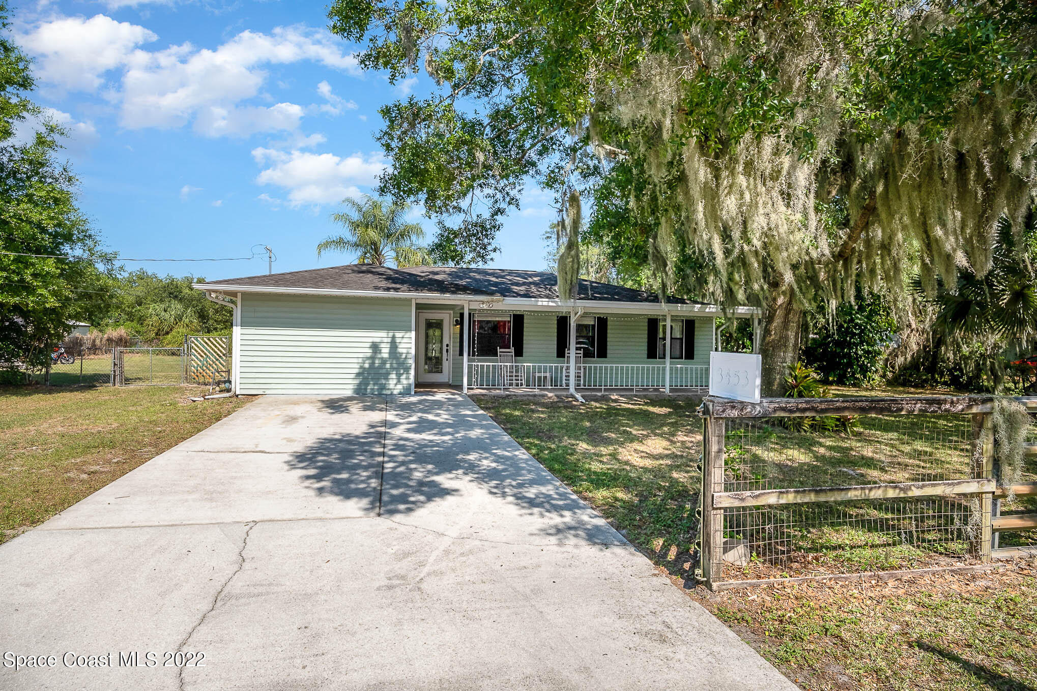 3453 Brevard Road Mims, FL 32754 - Photo 2 of 22 front view of a house with a yard