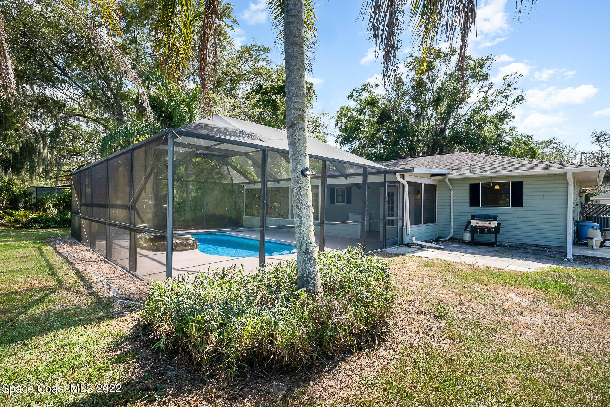 3453 Brevard Road Mims, FL 32754 - Photo 21 of 22 a view of a house with backyard and sitting area
