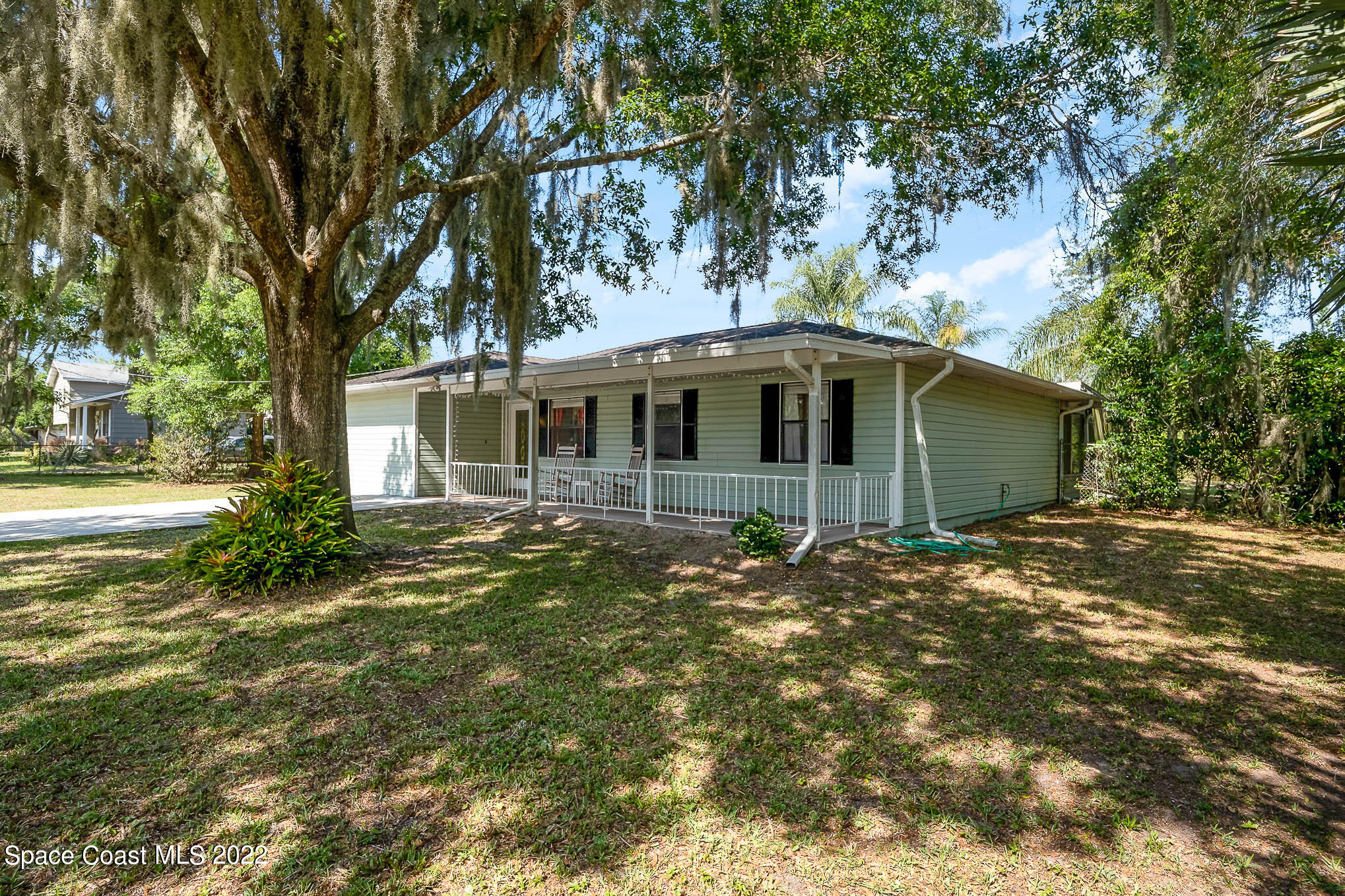 3453 Brevard Road Mims, FL 32754 - Photo 3 of 22 a view of a house with a garden