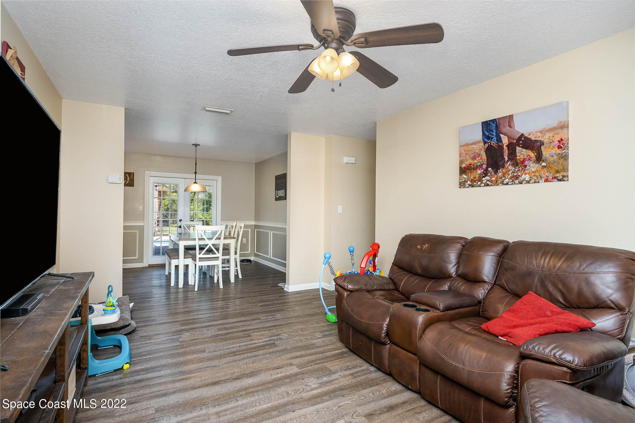 3453 Brevard Road Mims, FL 32754 - Photo 4 of 22 a living room with furniture a dining table and a piano