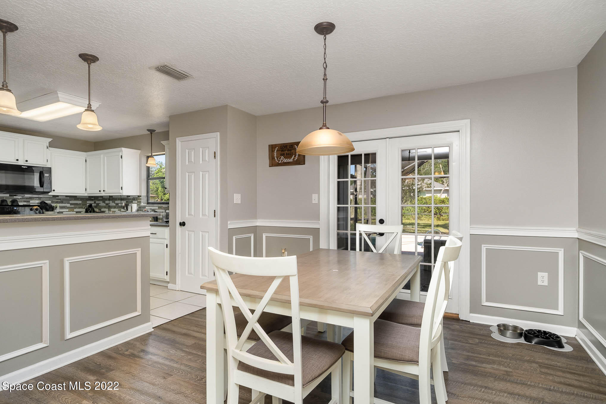 3453 Brevard Road Mims, FL 32754 - Photo 6 of 22 a view of a dining room with furniture window and wooden floor