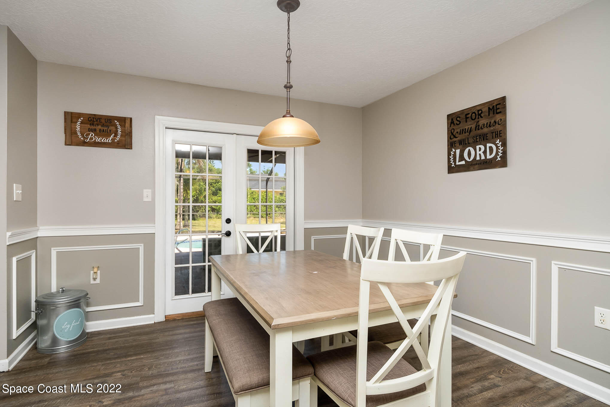 3453 Brevard Road Mims, FL 32754 - Photo 7 of 22 a view of a dining room with furniture window and wooden floor