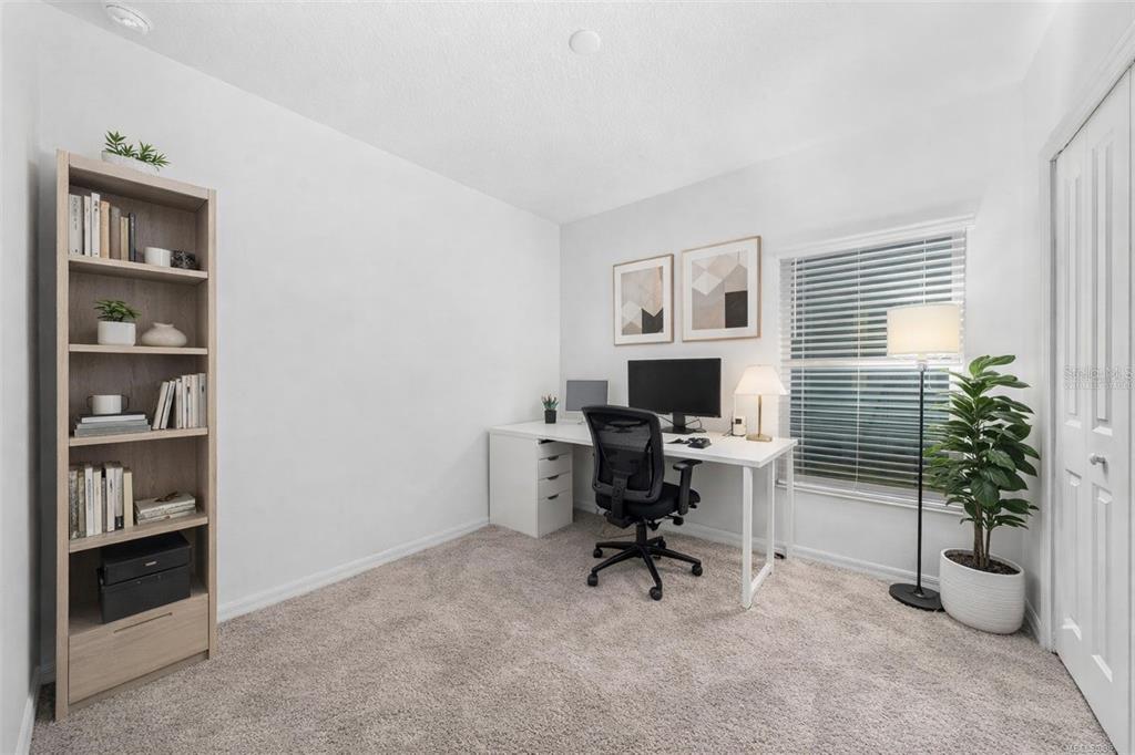 3977 Willowbrook Drive Edgewater, FL 32141 - Photo 18 of 22 a view of a workspace with a window and potted plant