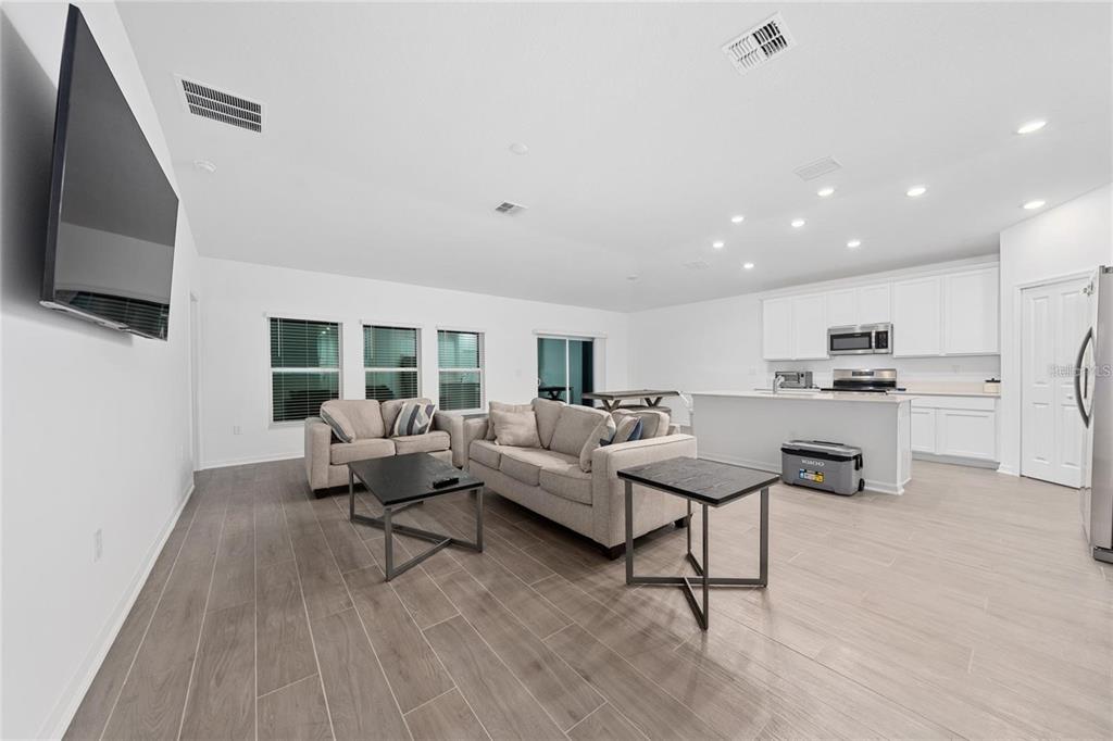 3977 Willowbrook Drive Edgewater, FL 32141 - Photo 9 of 22 a living room with furniture and a flat screen tv