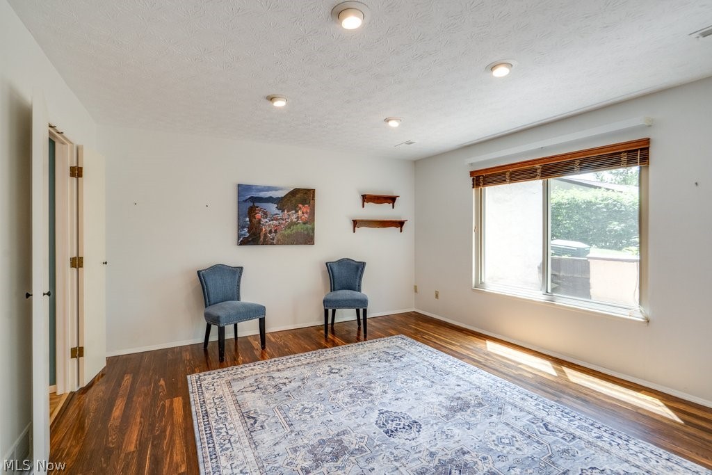 3388 South Smith Road Fairlawn, OH 44333 - Photo 28 of 31 Large Dining Room with laminated flooring, Shades on all windows. Good lighting and convenient doors to Kitchen for more privacy.