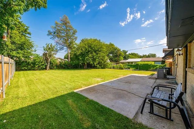 a view of a house with a yard porch and sitting area