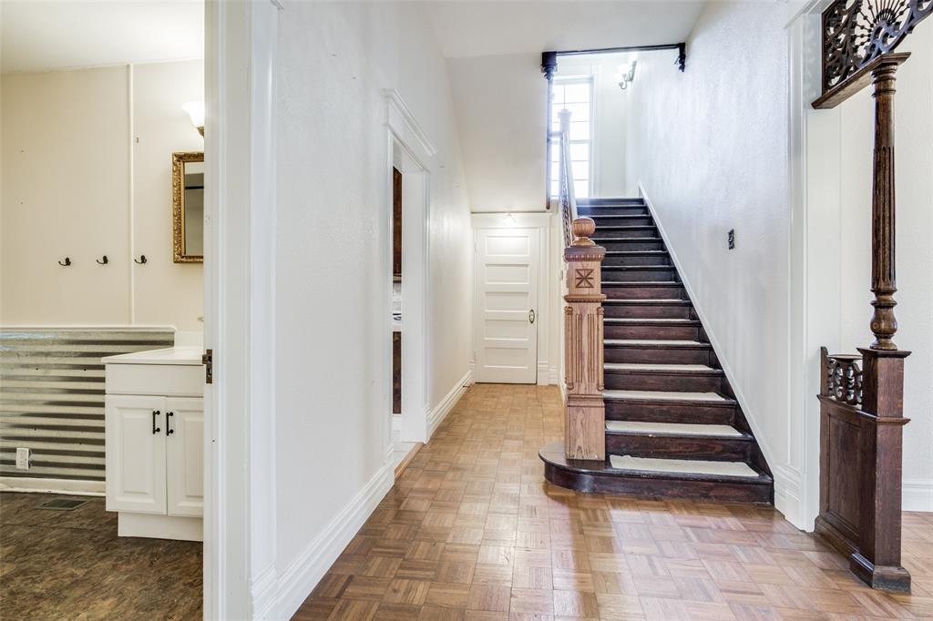1211 Cherokee Street Weatherford, TX 76086 - Photo 11 of 29 a view of a hallway with stairs and a room with stairs