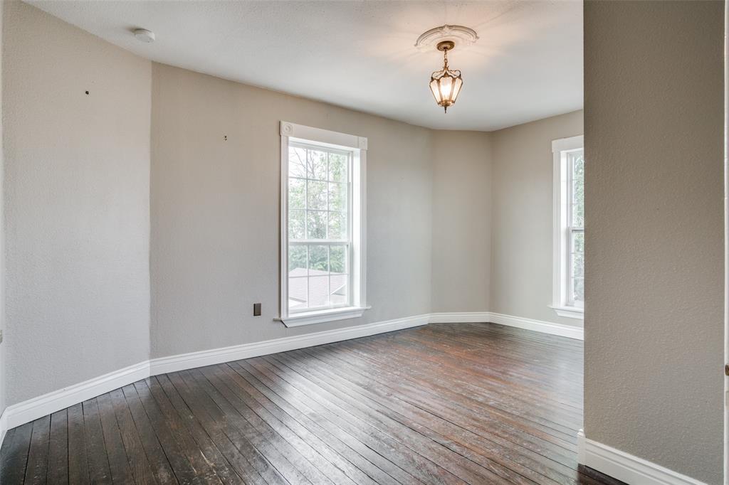 1211 Cherokee Street Weatherford, TX 76086 - Photo 13 of 29 wooden floor in an empty room with a window
