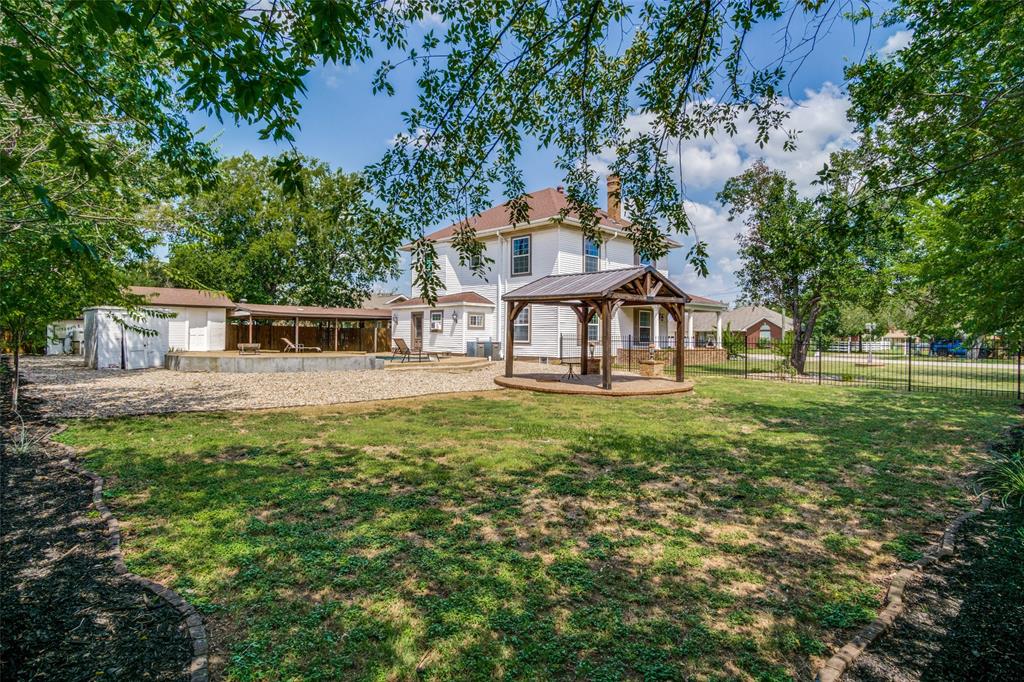 1211 Cherokee Street Weatherford, TX 76086 - Photo 23 of 29 a view of a house with a backyard porch and sitting area