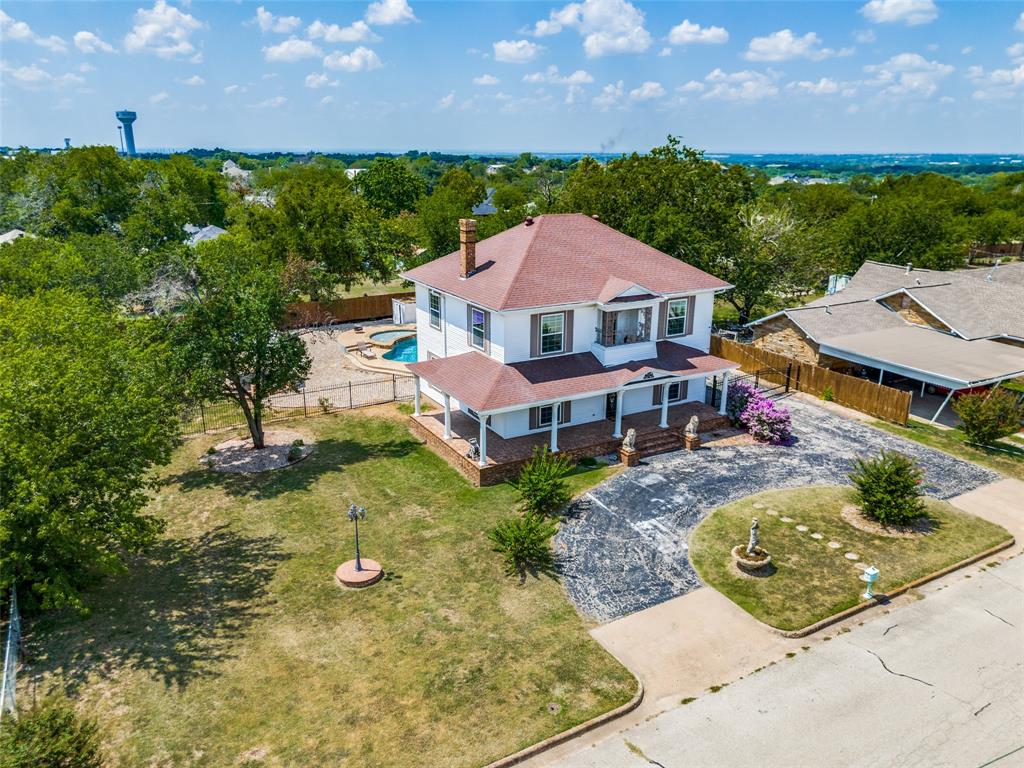 1211 Cherokee Street Weatherford, TX 76086 - Photo 25 of 29 a front view of a house with a yard
