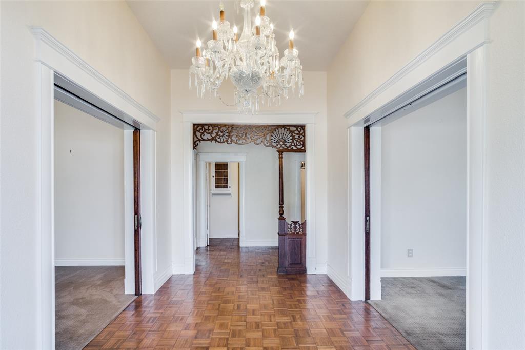 1211 Cherokee Street Weatherford, TX 76086 - Photo 5 of 29 a view of a hallway with a chandelier