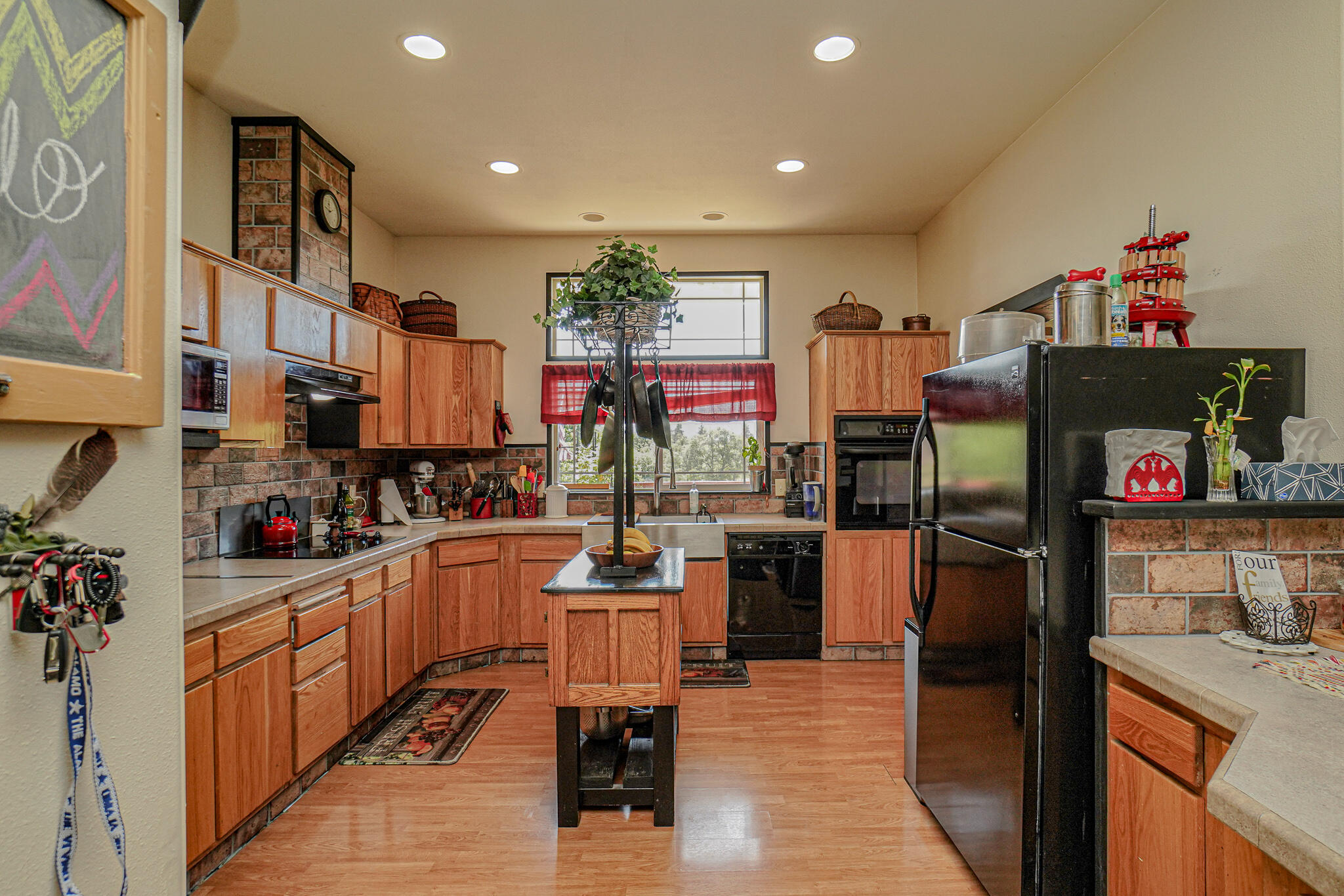 6297 Dodge Road White City, OR 97503 - Photo 10 of 45 a kitchen with stainless steel appliances granite countertop a refrigerator and a stove