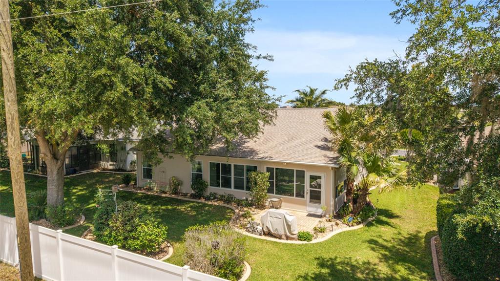 16369 Southwest 14th Avenue Road Ocala, FL 34473 - Photo 42 of 49 a front view of a house with swimming pool and furniture