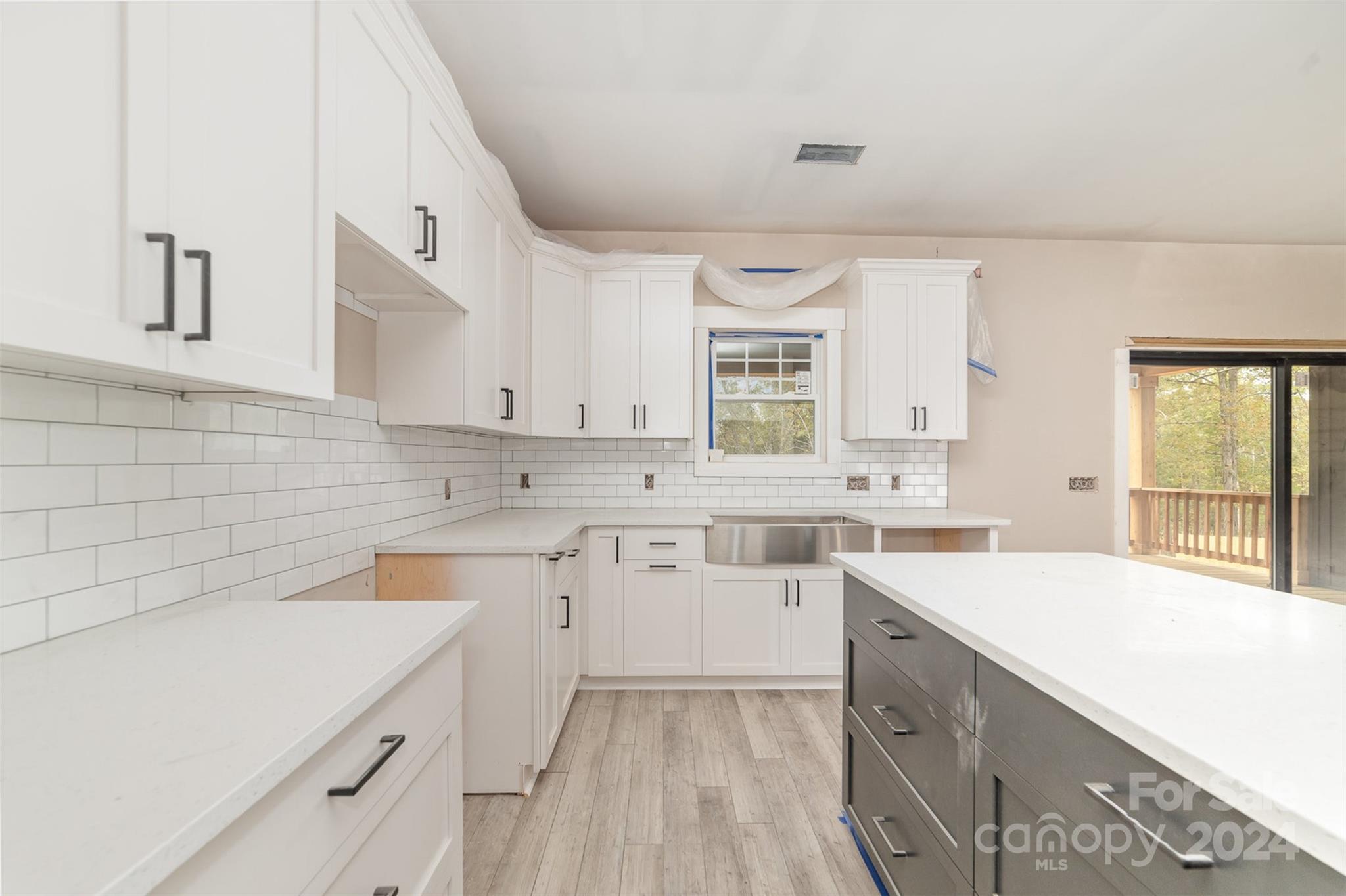 1820 Red Angus Road Mount Pleasant, NC 28124 - Photo 11 of 24 a kitchen with a sink stove and cabinets