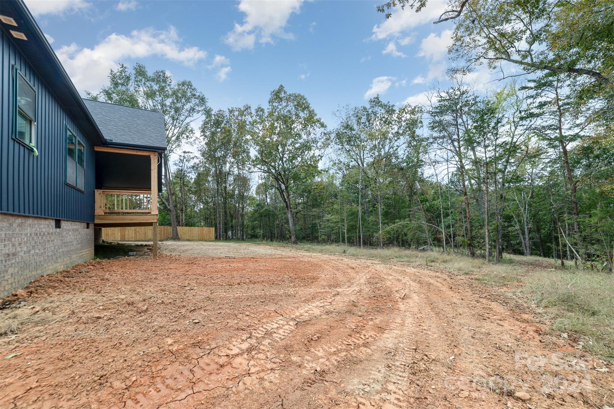 1820 Red Angus Road Mount Pleasant, NC 28124 - Photo 21 of 24 a backyard of a house with wooden floor and fence