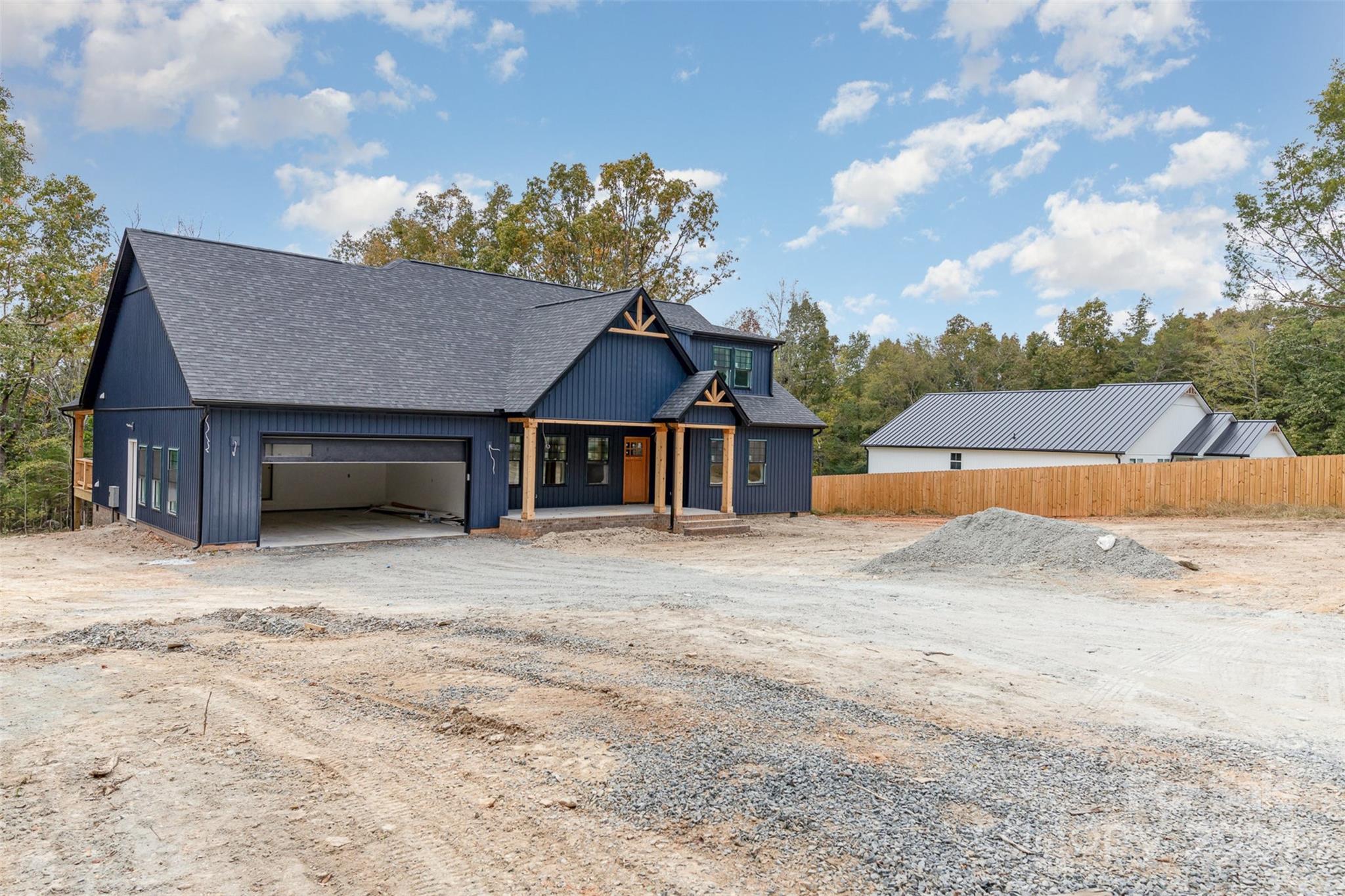 1820 Red Angus Road Mount Pleasant, NC 28124 - Photo 3 of 24 a front view of a house with a yard and garage