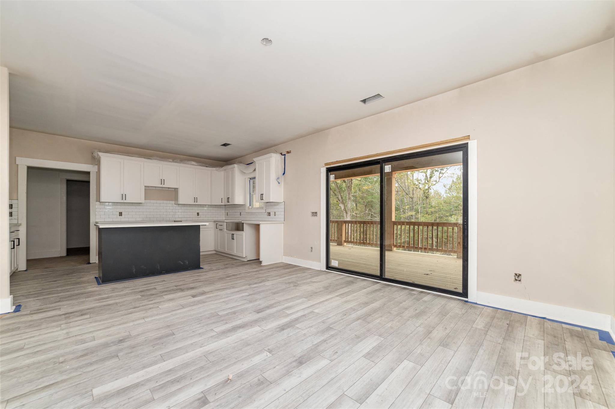 1820 Red Angus Road Mount Pleasant, NC 28124 - Photo 8 of 24 a view of a kitchen with wooden floor and electronic appliances