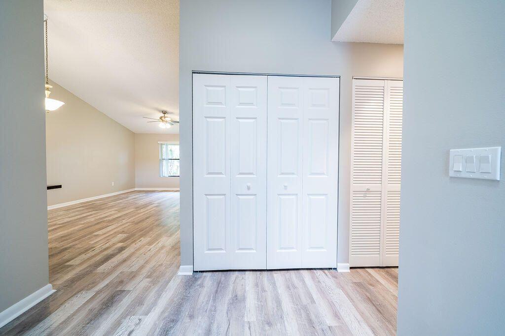 12969 Pennypacker Trail, Unit 15 Wellington, FL 33414 - Photo 14 of 25 a view of empty room with wooden floor