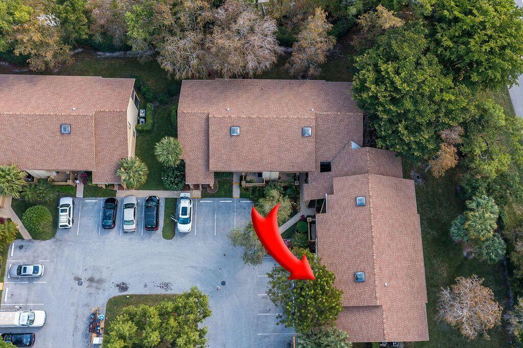 12969 Pennypacker Trail, Unit 15 Wellington, FL 33414 - Photo 22 of 25 an aerial view of a house with a yard and lake view