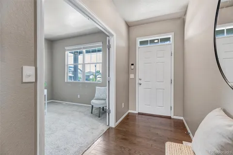 an empty room with windows and a bathroom