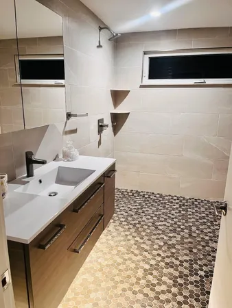 a bathroom with a sink and a mirror