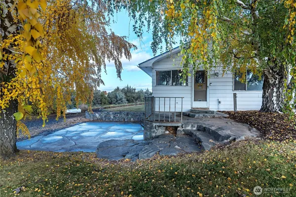 a view of a big yard with a house