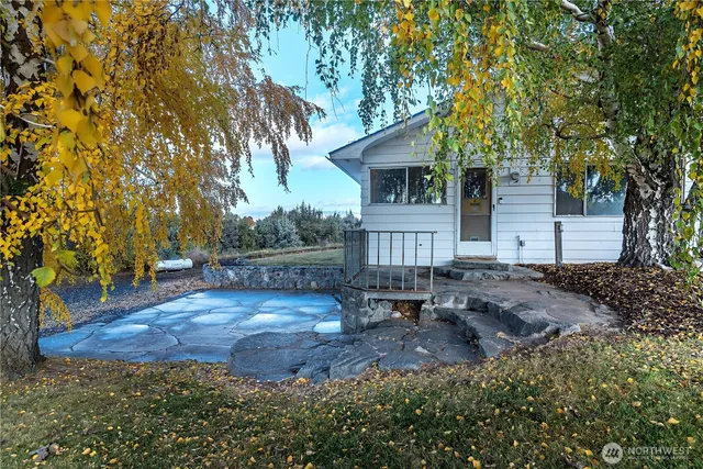 a view of a big yard with a house
