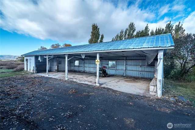 an aerial view of residential house with outdoor space and river