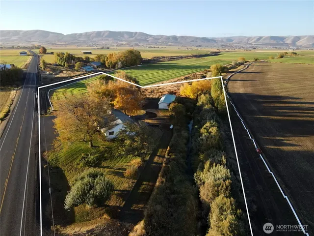 an aerial view of residential house with outdoor space and river