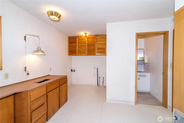 a view of a storage & utility room with a window