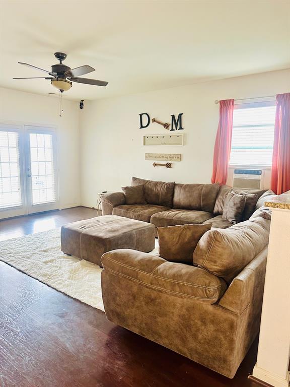 111 Rebel Road Venus, TX 76084 - Photo 6 of 7 Spacious room featuring rich wood-finish flooring, light-toned walls, and a ceiling fan with integrated lighting