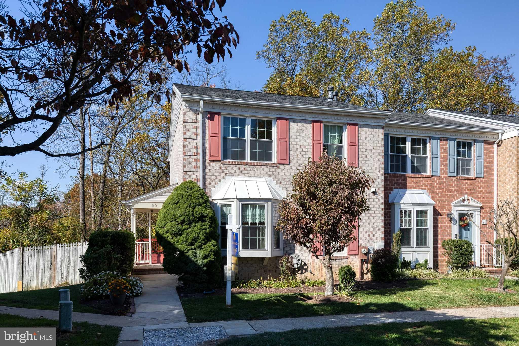 a front view of a house with a yard garage and outdoor seating