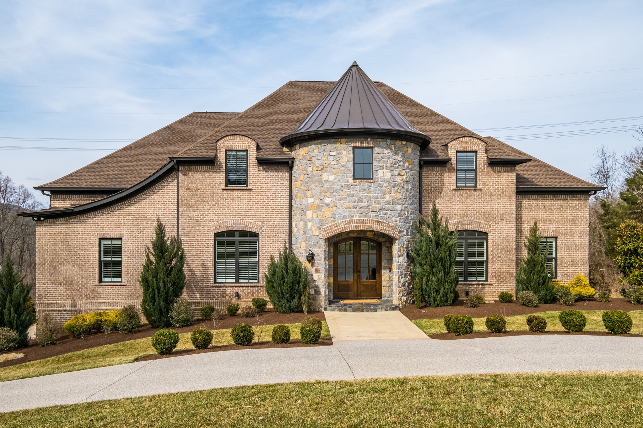 a front view of a house with a yard