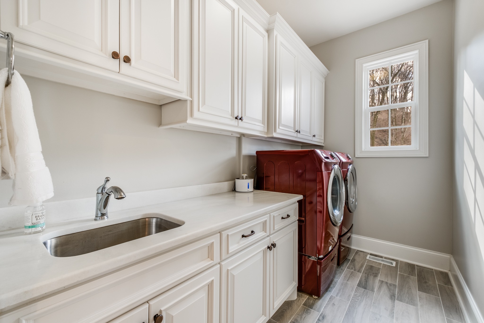 514 Legends Ridge Court Franklin, TN 37069 - Photo 32 of 57 a kitchen with stainless steel appliances granite countertop a sink and cabinets with wooden floor