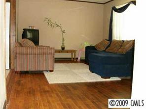 4809 Union Road Gastonia, NC 28056 - Photo 4 of 8 a living room with furniture and a flat screen tv
