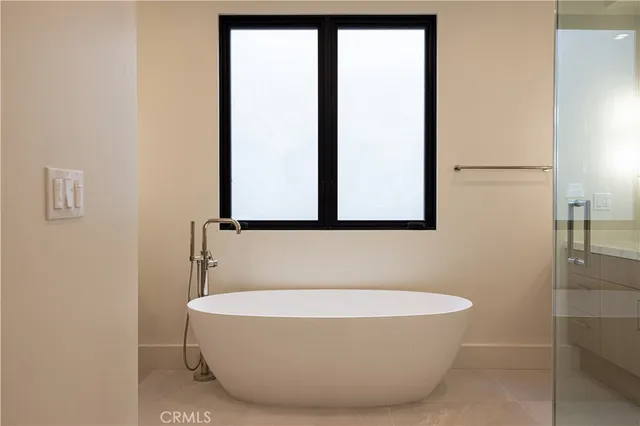 a view of an empty room and windows