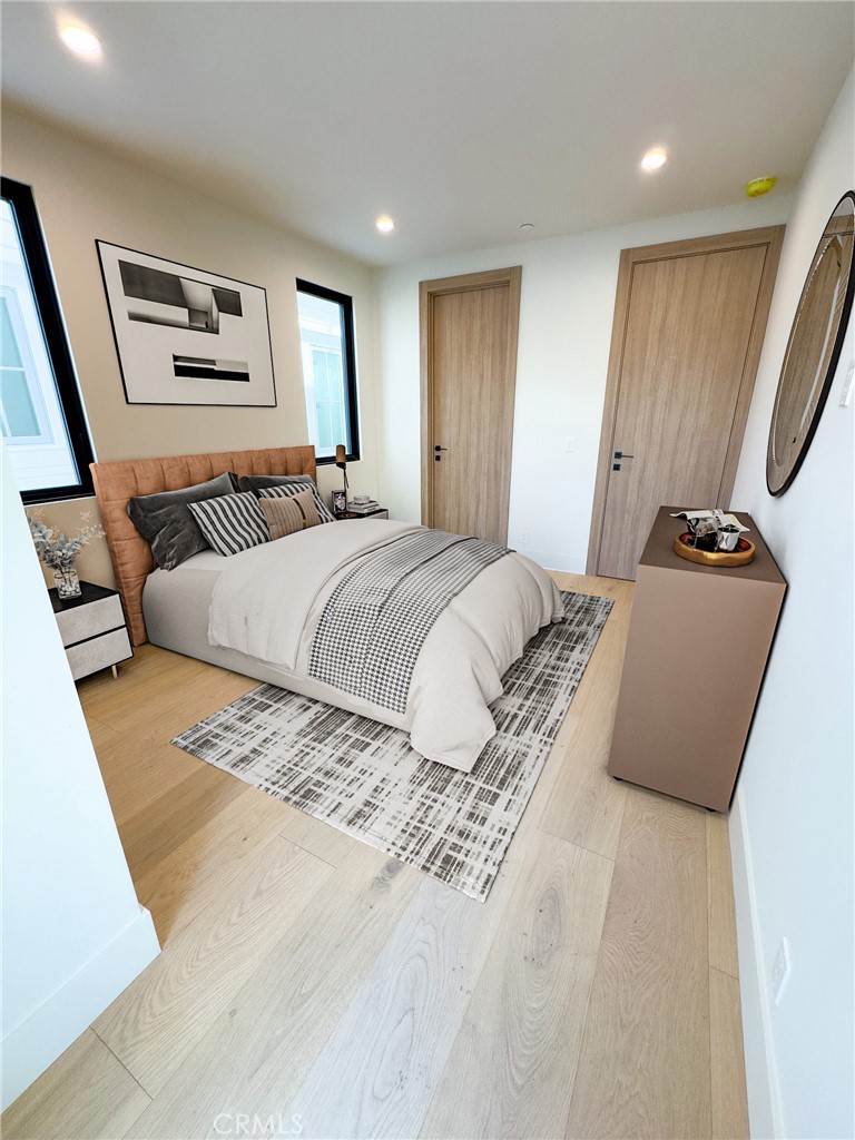 404 16th Street Manhattan Beach, CA 90266 - Photo 16 of 58 a bedroom with a large bed and a couch