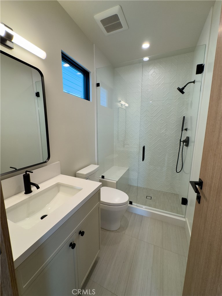 404 16th Street Manhattan Beach, CA 90266 - Photo 21 of 58 a bathroom with a sink a toilet and shower